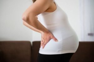 Смещение центра тяжести тела беременной	